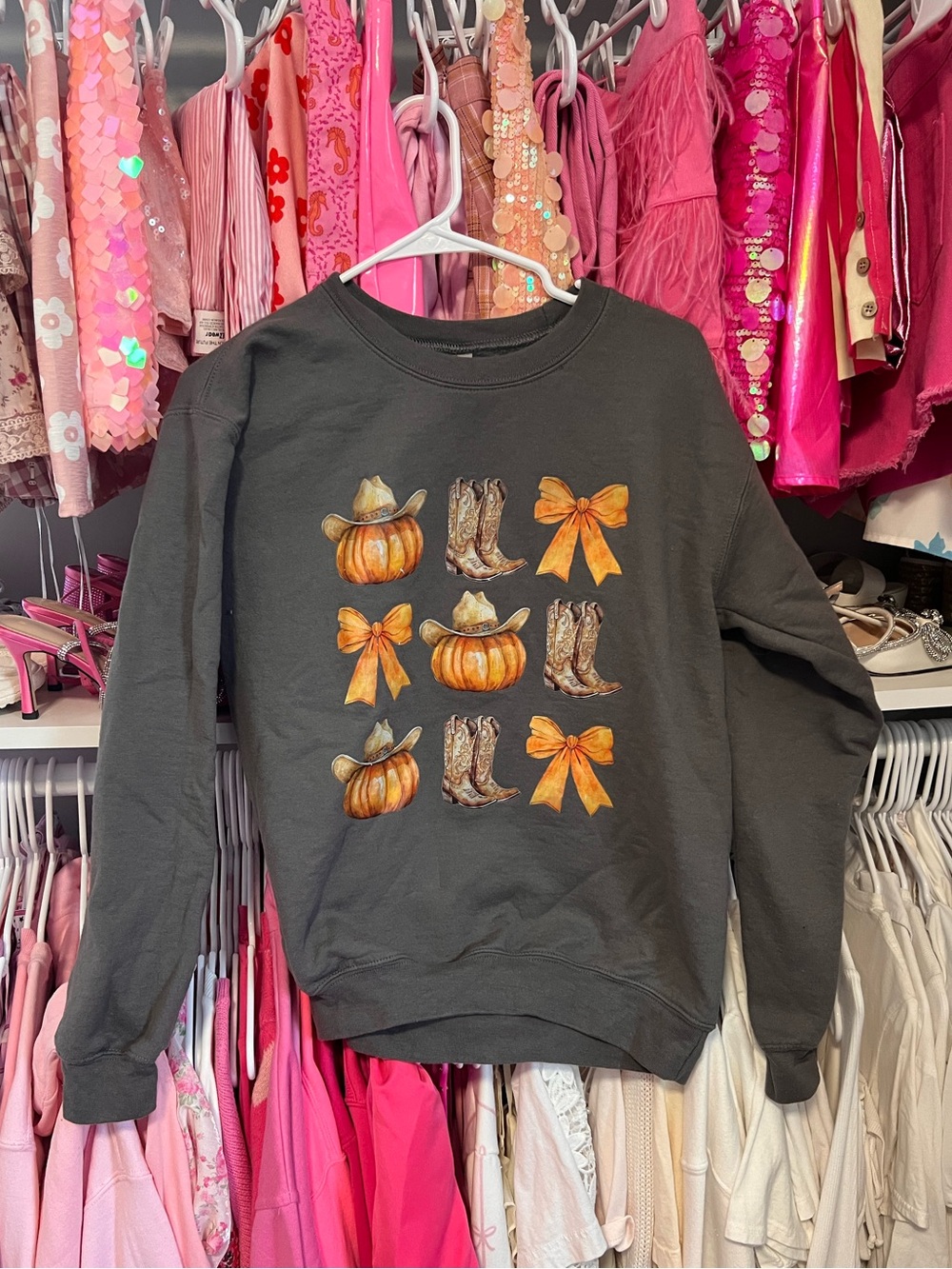 Women’s Black Pullover Sweatshirt with Orange Pumpkin & Bow Graphic